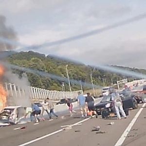SEE IT: Woman pulled out of burning vehicle following massive crash involving tractor-trailer in... - YouTube