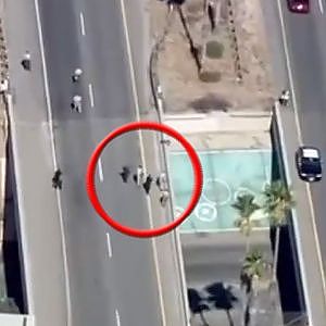 Police chase ends with driver pulled from highway overpass - YouTube